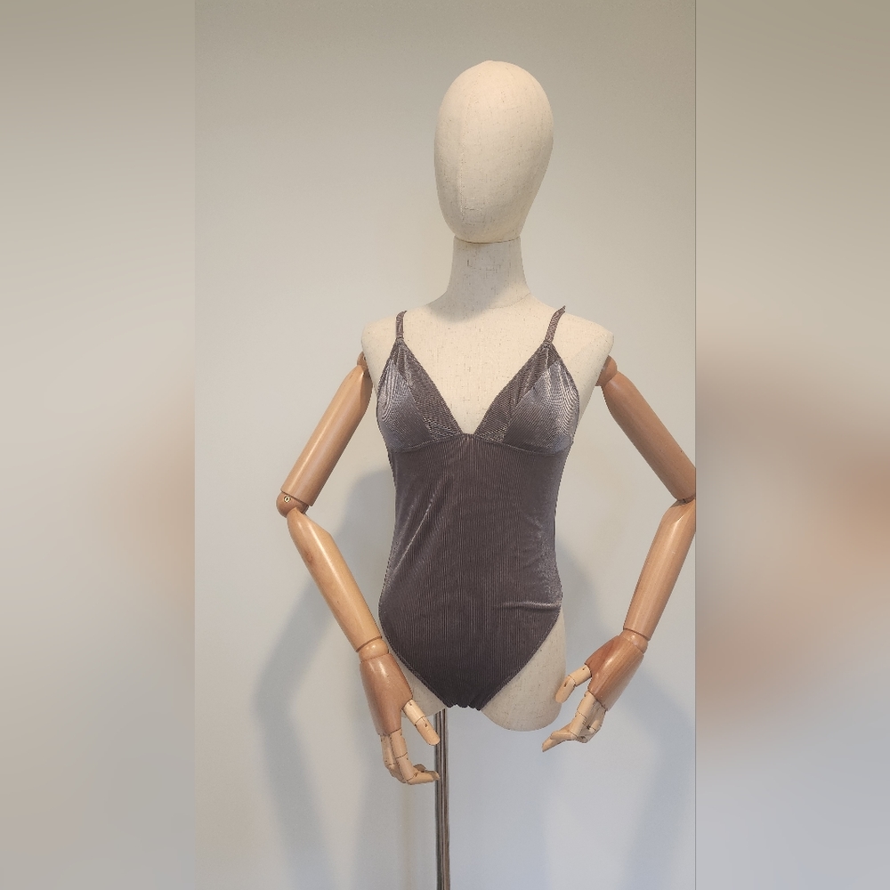 Bodysuit. Metalic shiny finish. NWOT.